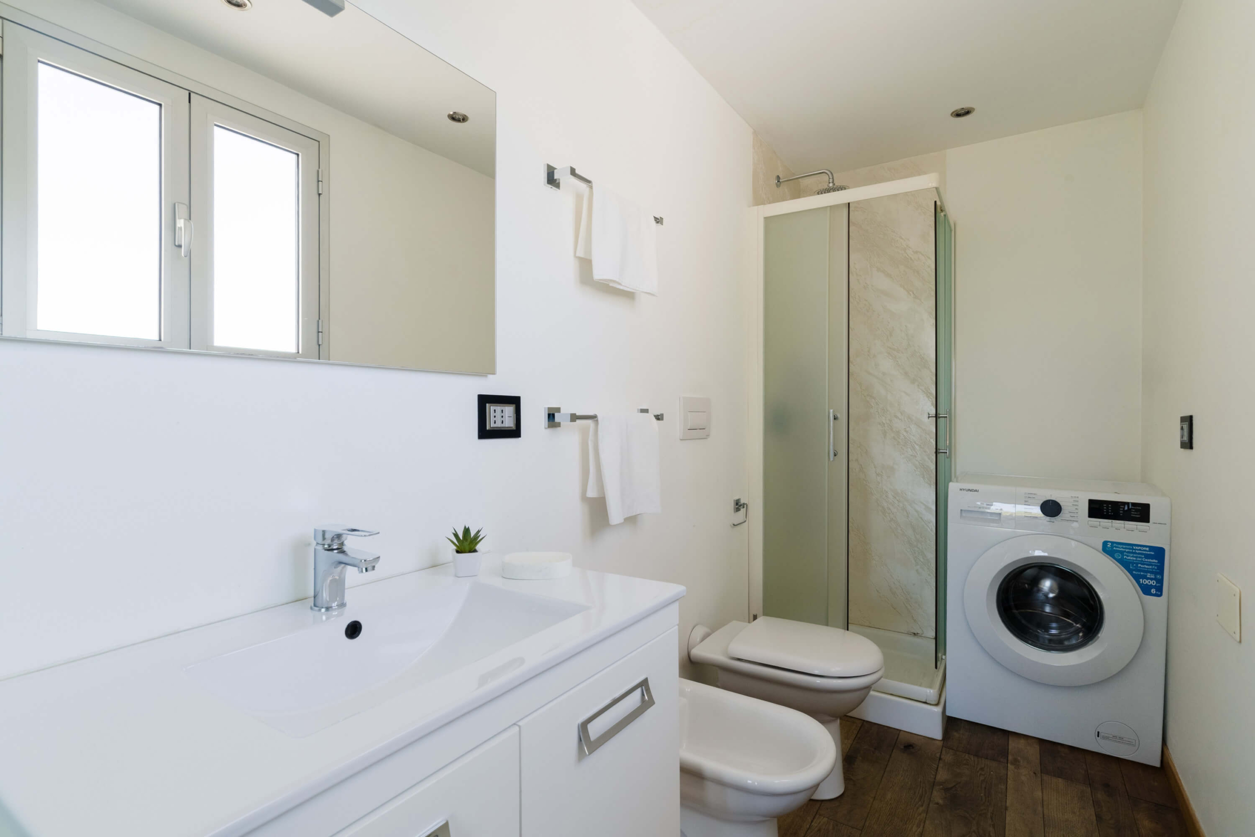 bagno con lavatrice attico cucci